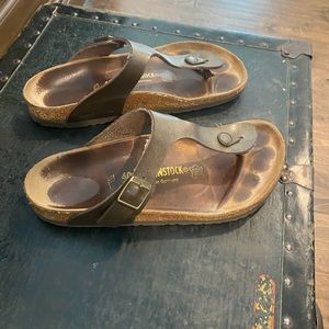 Well loved sandals. Lots of wear left.